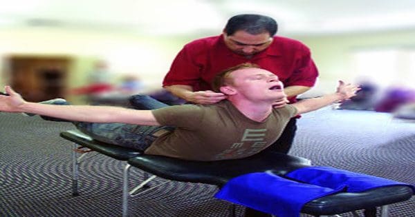 blog picture of man getting network therapy from chiropractor