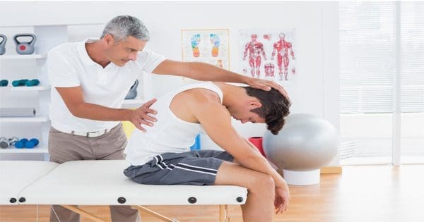 blog picture of chiropractor stretching a man's back