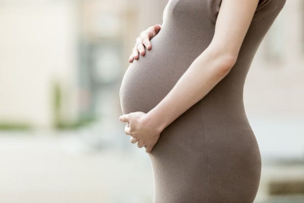 expectant mother standing