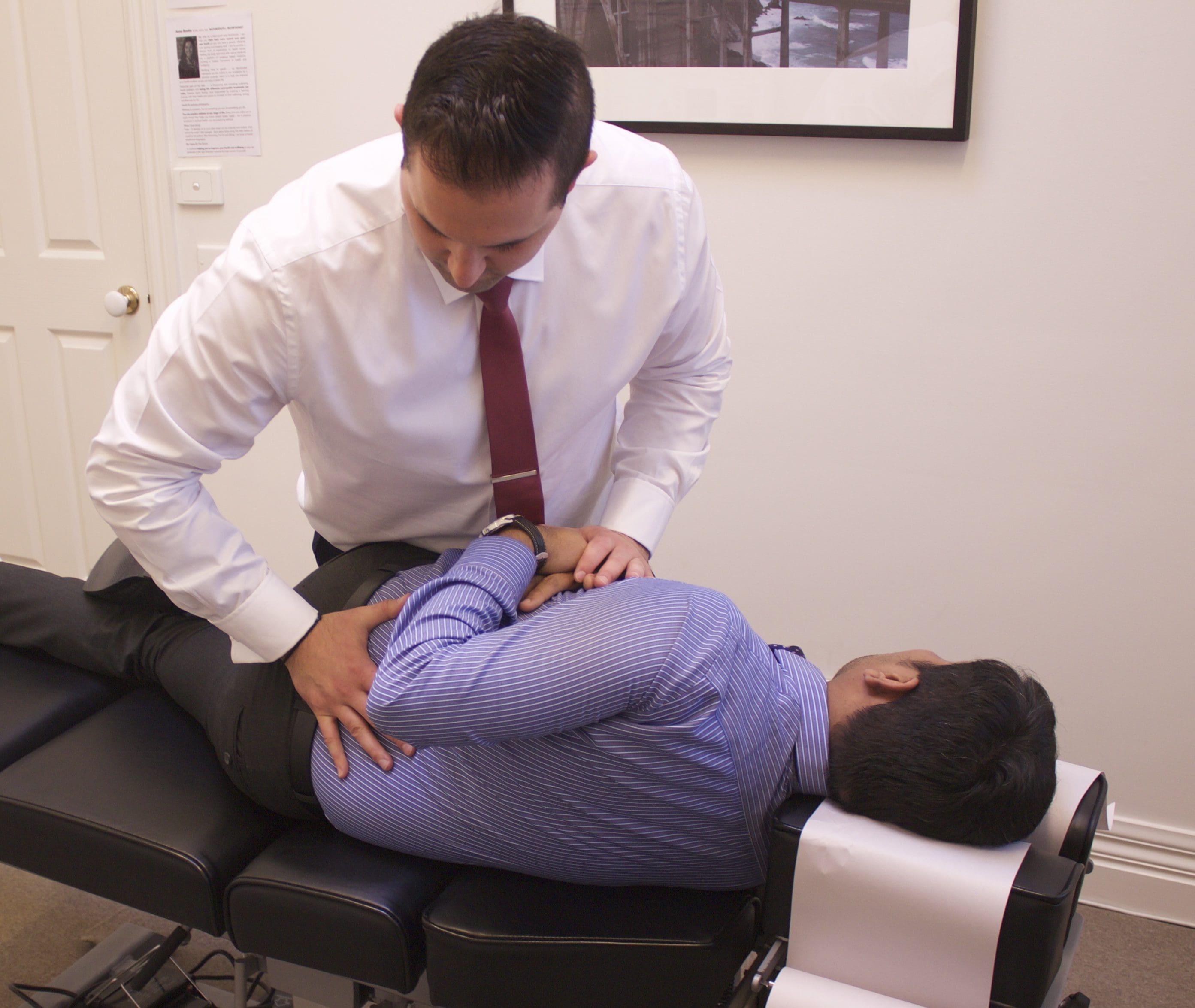 Image of a chiropractor performing spinal adjustments and manual manipulations for low back pain and sciatica.